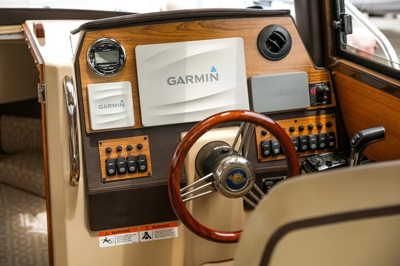 Slide: The Image of 2018 Ranger Tugs R-23 helm with Garmin navigation and Yamaha controls. - 21