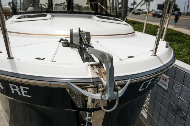Slide: The Image of 2018 Ranger Tugs R-23 boat with anchor, docked near a road. - 3