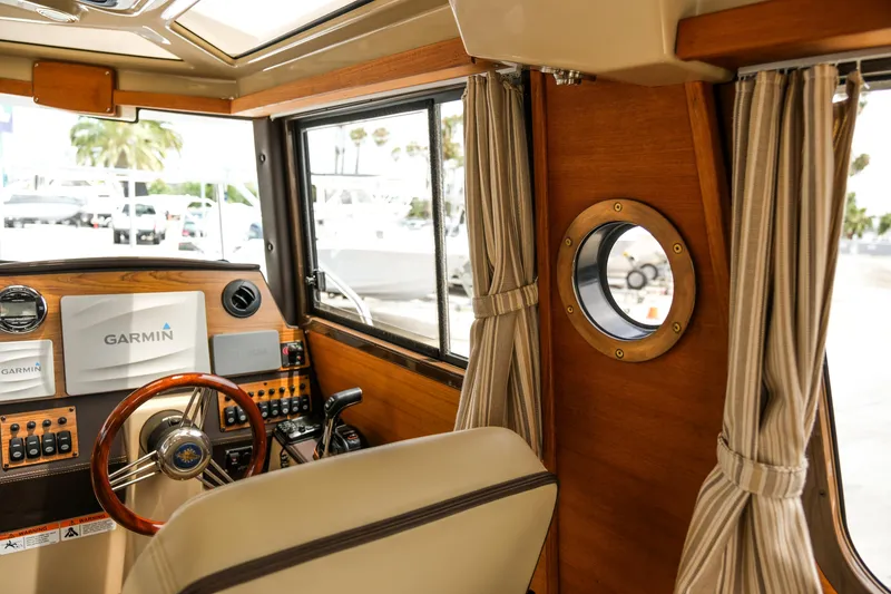 Slide: The Image of Interior of 2018 Ranger Tugs R-23 boat with Garmin navigation system and wooden accents. - 33