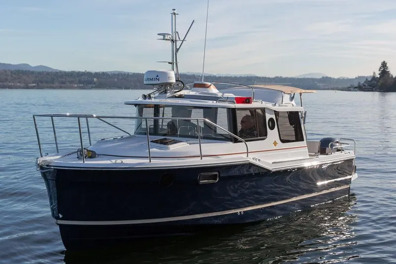 Slide: The Image of Manufacturer Provided Image: 2018 Ranger Tugs R-23 boat on calm water with scenic background. - 44