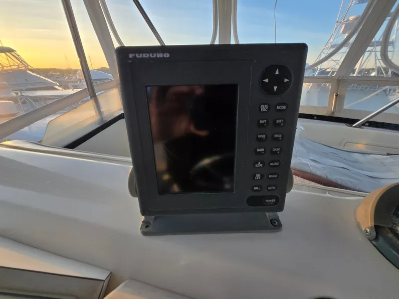 Slide: The Image of Furuno navigation system on 1988 Ocean 35 Super Sport boat, sunset view. - 22