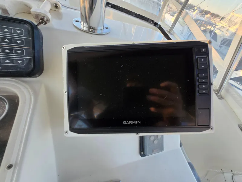 Slide: The Image of Garmin navigation system on 1988 Ocean 35 Super Sport boat dashboard. - 23