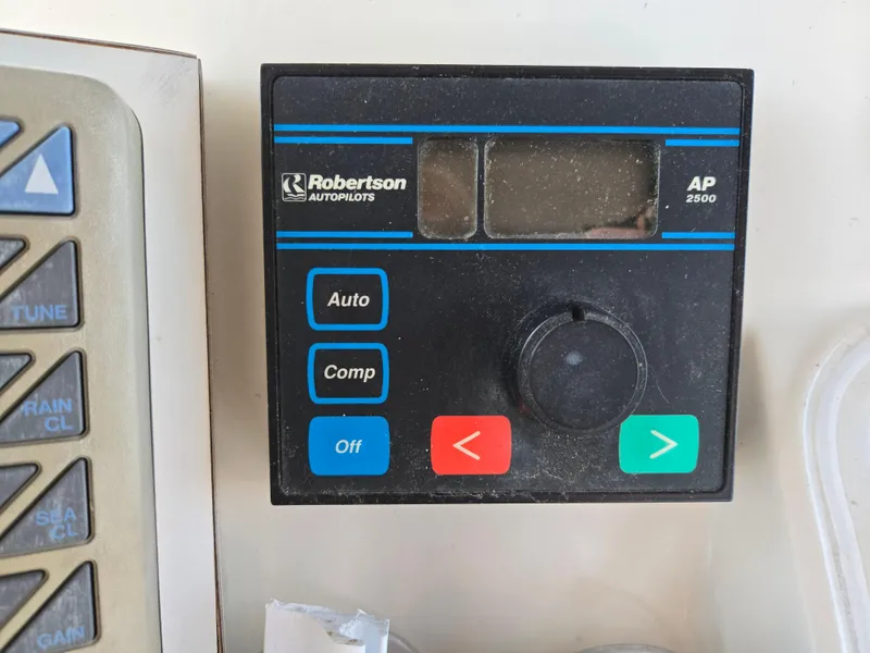 Slide: The Image of Robertson AP2500 autopilot control panel on 1988 Ocean 35 Super Sport boat. - 25