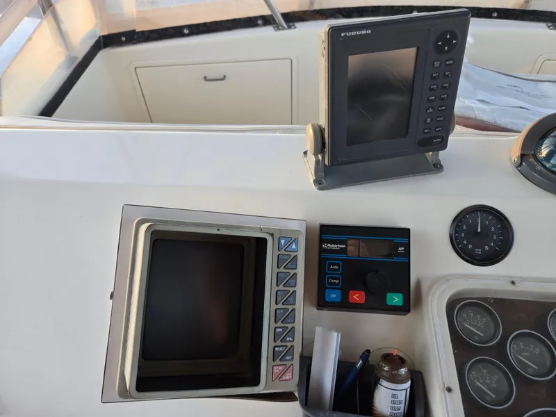 Slide: The Image of Control panel of a 1988 Ocean 35 Super Sport boat with navigation equipment. - 26