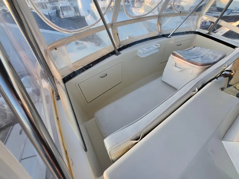 Slide: The Image of Interior view of 1988 Ocean 35 Super Sport boat with seating and storage compartments. - 30
