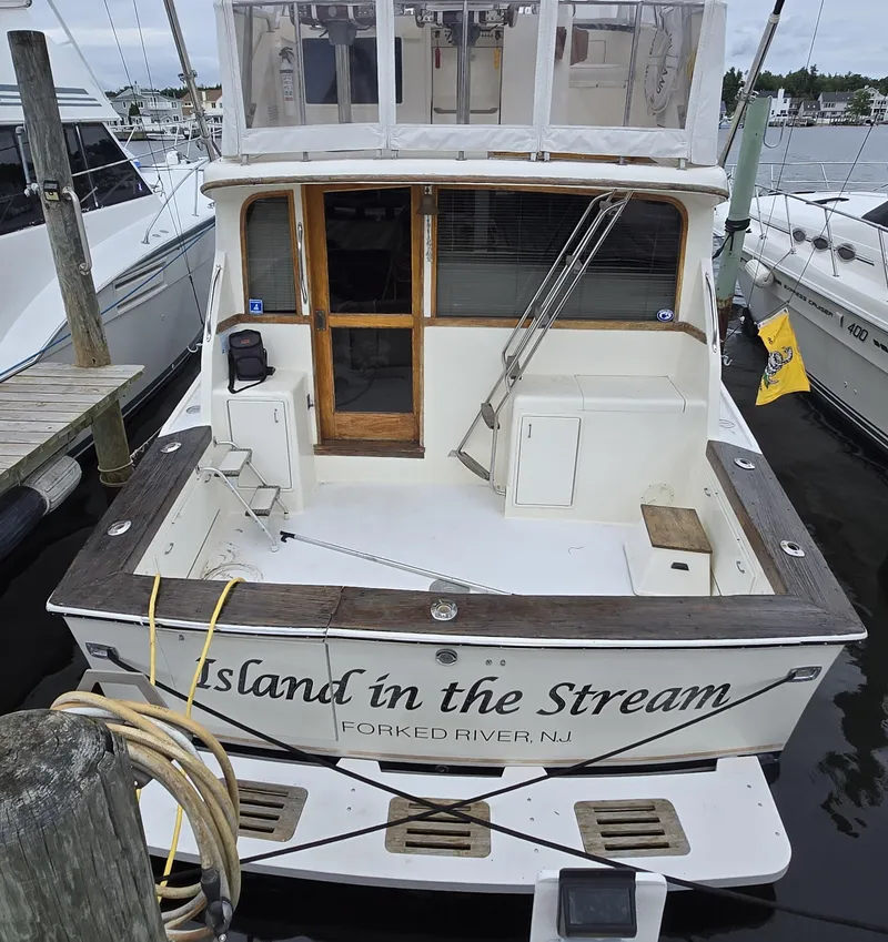 Slide: The Image of 1988 Ocean 35 Super Sport boat docked, named "Island in the Stream," Forked River, NJ. - 37