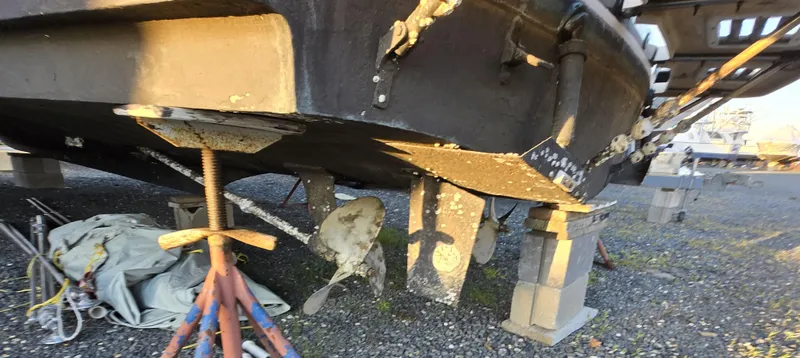 Slide: The Image of 1988 Ocean 35 Super Sport boat on stands, showing hull and propeller. - 40