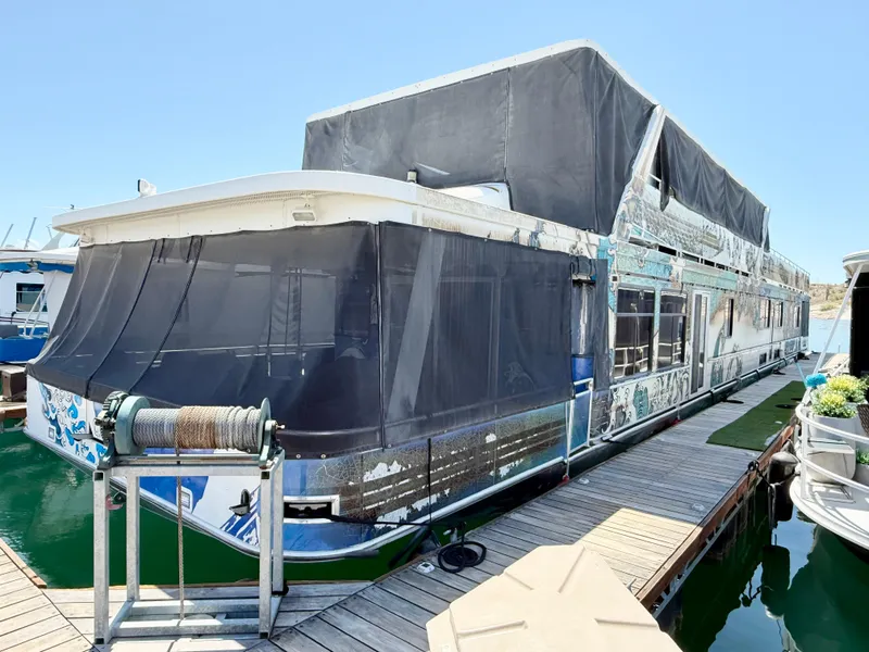 The Image of 2001 Sumerset 18x104 houseboat docked with covered upper deck and winch. - 1