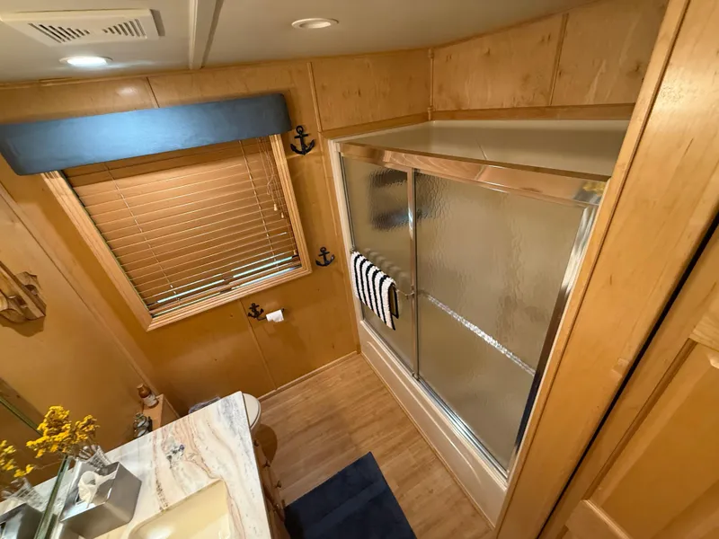 Slide: The Image of Bathroom interior of 2001 Sumerset 18x104 houseboat with shower and nautical decor. - 14
