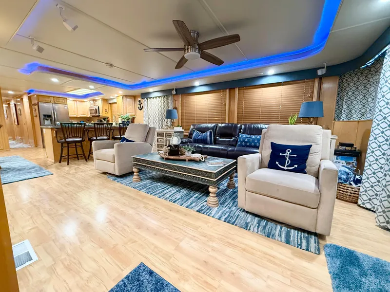 Slide: The Image of Luxurious 2001 Sumerset 18x104 houseboat interior with modern decor and comfortable seating. - 2