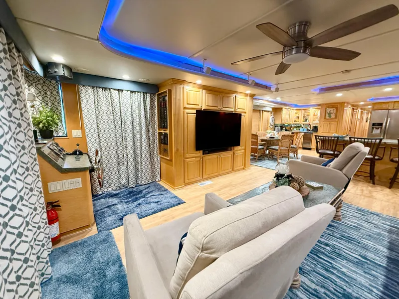 Slide: The Image of Luxurious 2001 Sumerset 18x104 houseboat interior with modern living area, kitchen, and stylish decor. - 3
