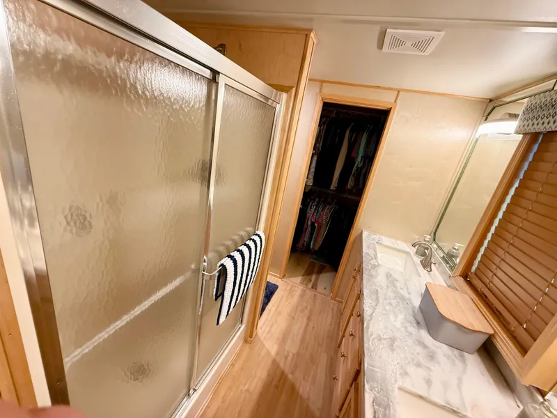 Slide: The Image of Bathroom interior of 2001 Sumerset 18x104 houseboat with shower, sink, and closet. - 31