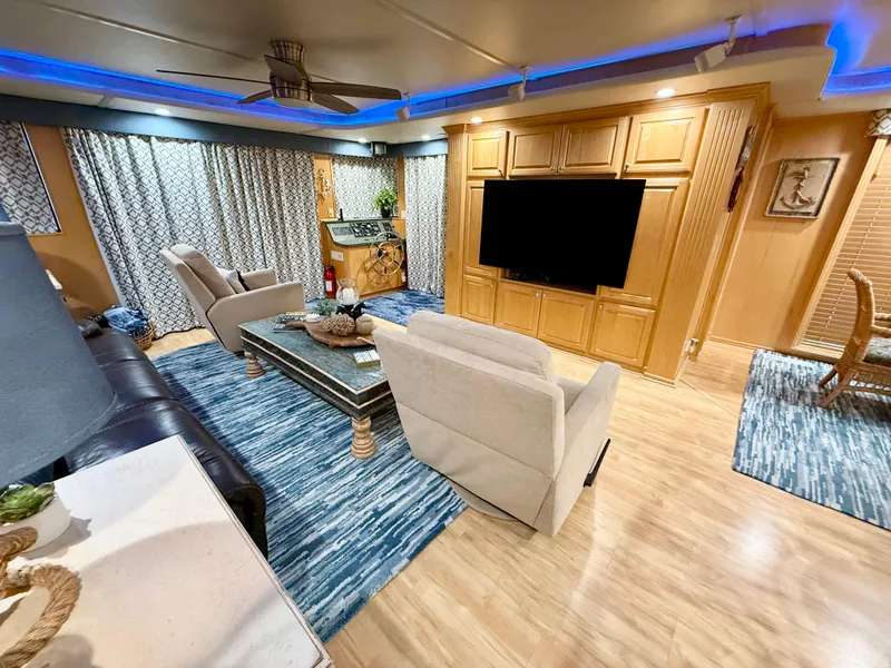 Slide: The Image of Luxurious 2001 Sumerset 18x104 houseboat interior with modern decor and entertainment center. - 45
