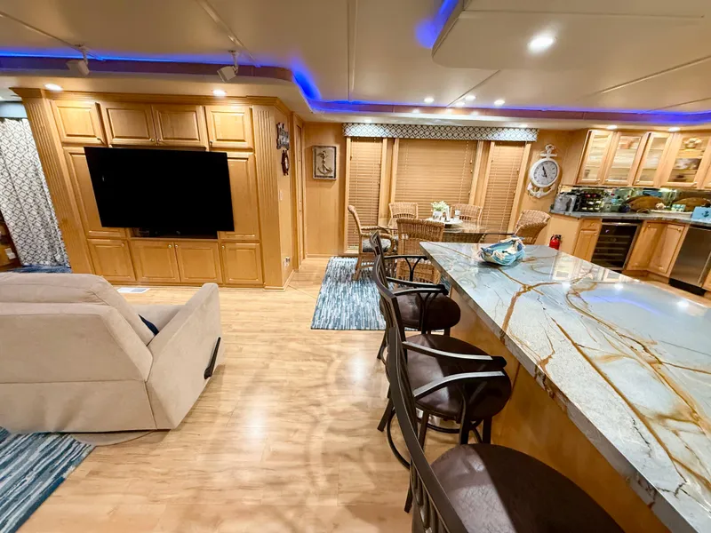 Slide: The Image of Luxurious 2001 Sumerset 18x104 houseboat interior with modern kitchen and cozy living area. - 6