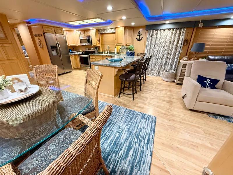 Slide: The Image of Luxurious 2001 Sumerset 18x104 houseboat interior with modern kitchen and cozy dining area. - 7