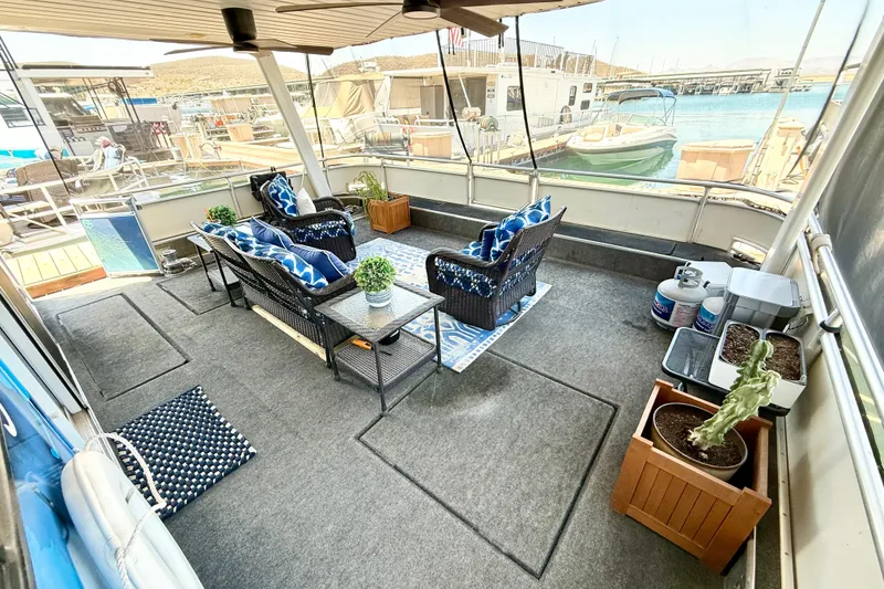 Slide: The Image of Outdoor seating area on 2001 Sumerset 18x104 houseboat with lake view. - 71