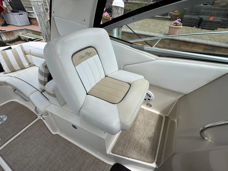 Slide: The Image of 2008 Sea Ray 350 Sundancer interior with cushioned seating and elegant design. - 12