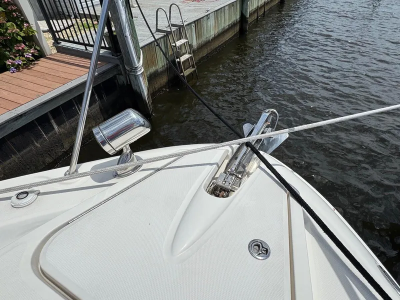 Slide: The Image of Bow of 2008 Sea Ray 350 Sundancer docked, featuring anchor and mooring lines. - 20