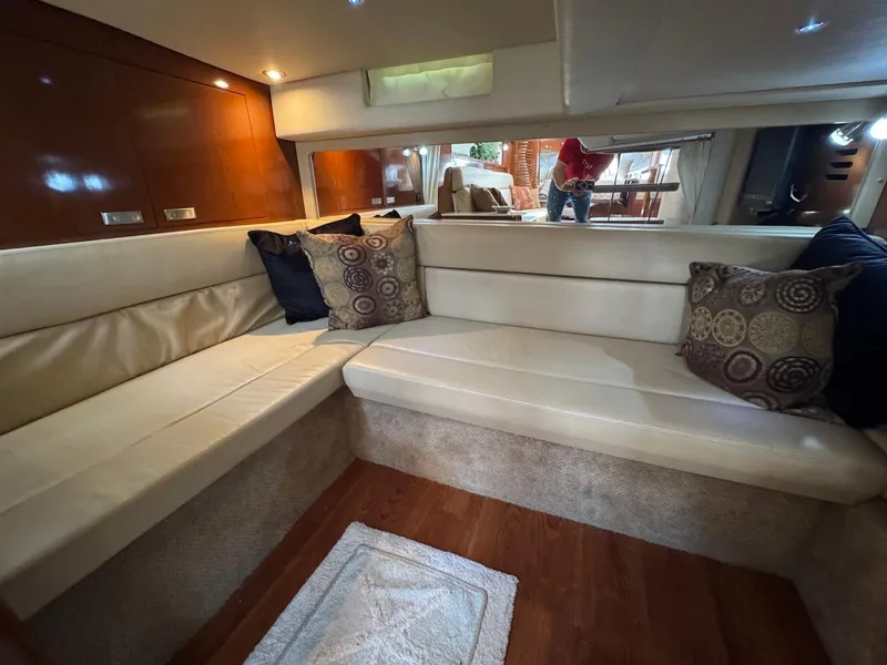Slide: The Image of Luxurious interior of 2008 Sea Ray 350 Sundancer with plush seating and decorative pillows. - 31