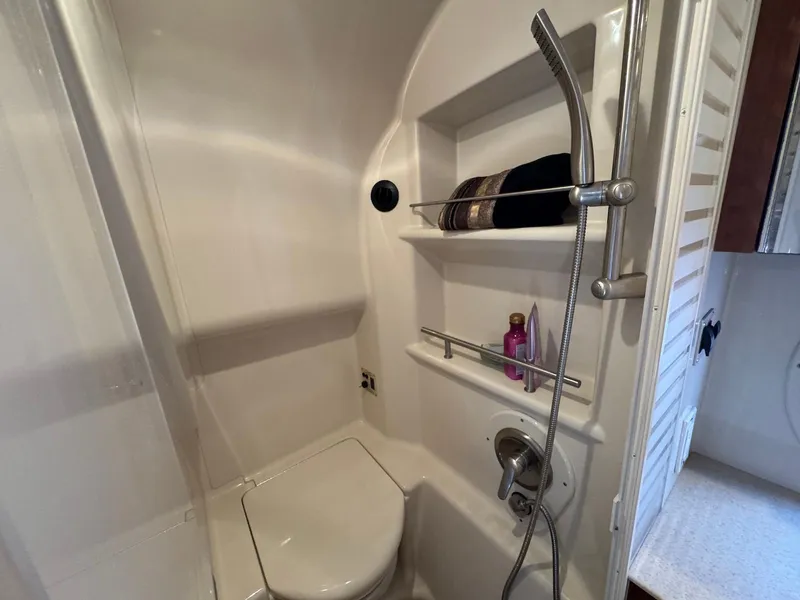 Slide: The Image of Bathroom interior of 2008 Sea Ray 350 Sundancer yacht, featuring shower and toilet. - 34