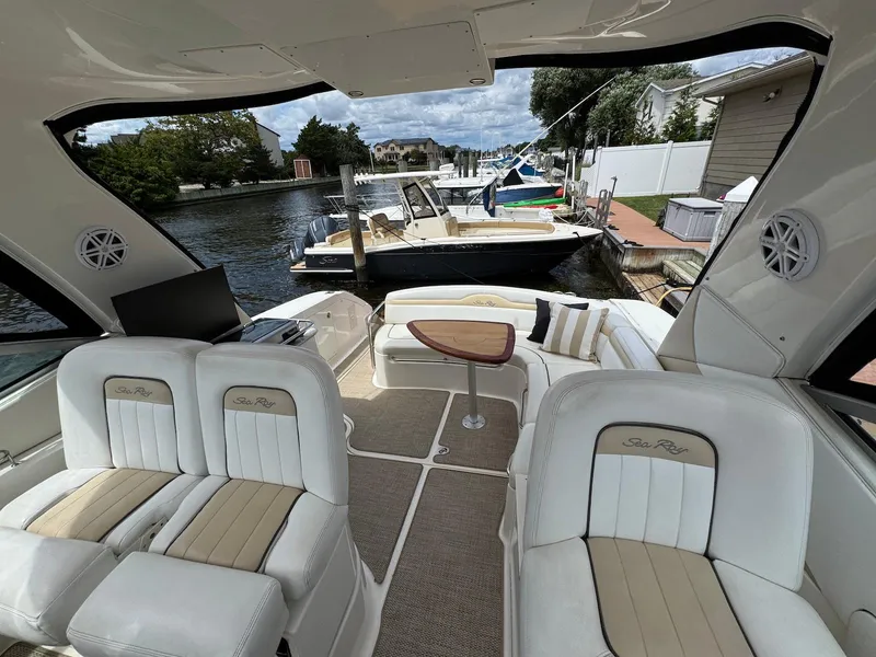 Slide: The Image of Interior of 2008 Sea Ray 350 Sundancer yacht with luxurious seating and water view. - 7