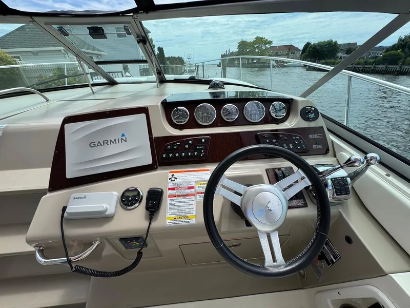 Slide: The Image of Cockpit of 2008 Sea Ray 350 Sundancer with Garmin navigation system and steering wheel. - 9