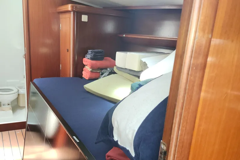 Slide: The Image of Interior cabin of 2003 Beneteau 50 yacht with bed and bathroom. - 30