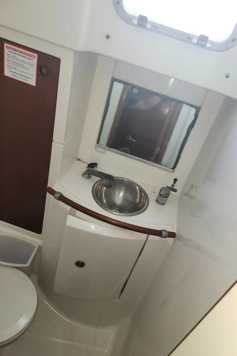 Slide: The Image of Bathroom interior of a 2003 Beneteau 50 yacht with sink and mirror. - 37
