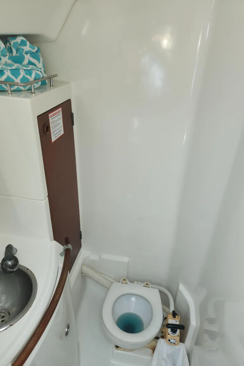 Slide: The Image of Bathroom of 2003 Beneteau 50 yacht with sink and toilet. - 38