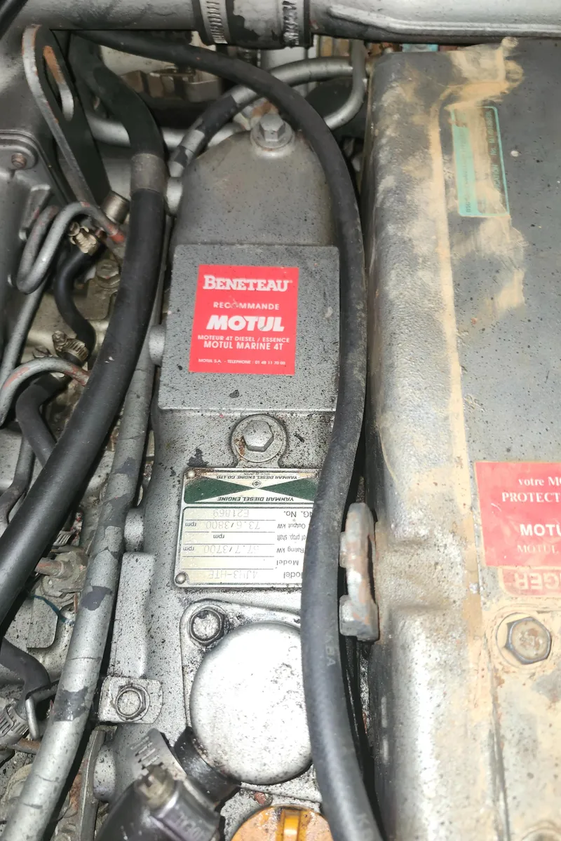 Slide: The Image of Engine compartment of a 2003 Beneteau 50 sailboat, featuring Motul Marine oil recommendation. - 43