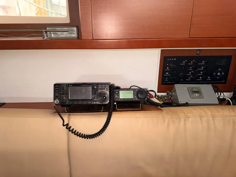 Slide: The Image of Radio equipment and control panel inside a 2016 Beneteau Oceanis 45 yacht. - 16