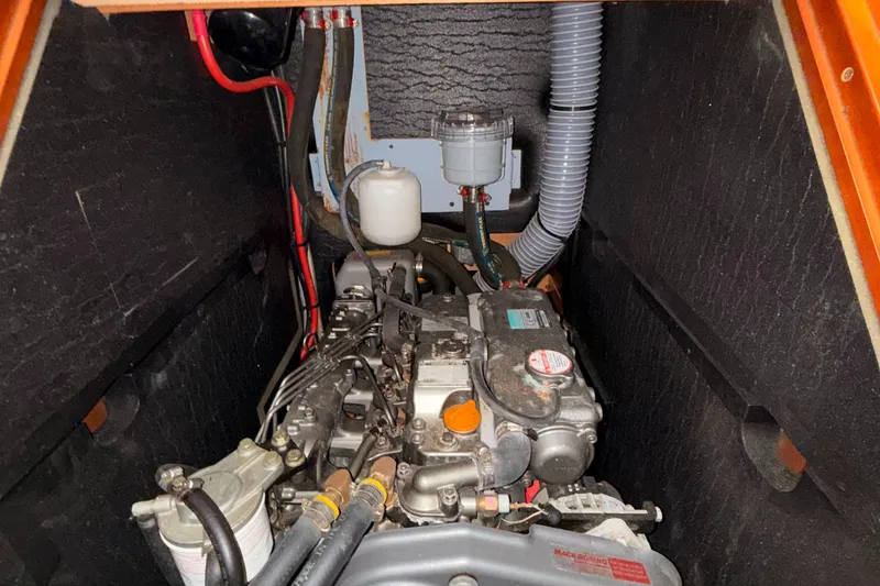 Slide: The Image of Engine compartment of a 2016 Beneteau Oceanis 45 sailboat, showcasing mechanical components. - 47