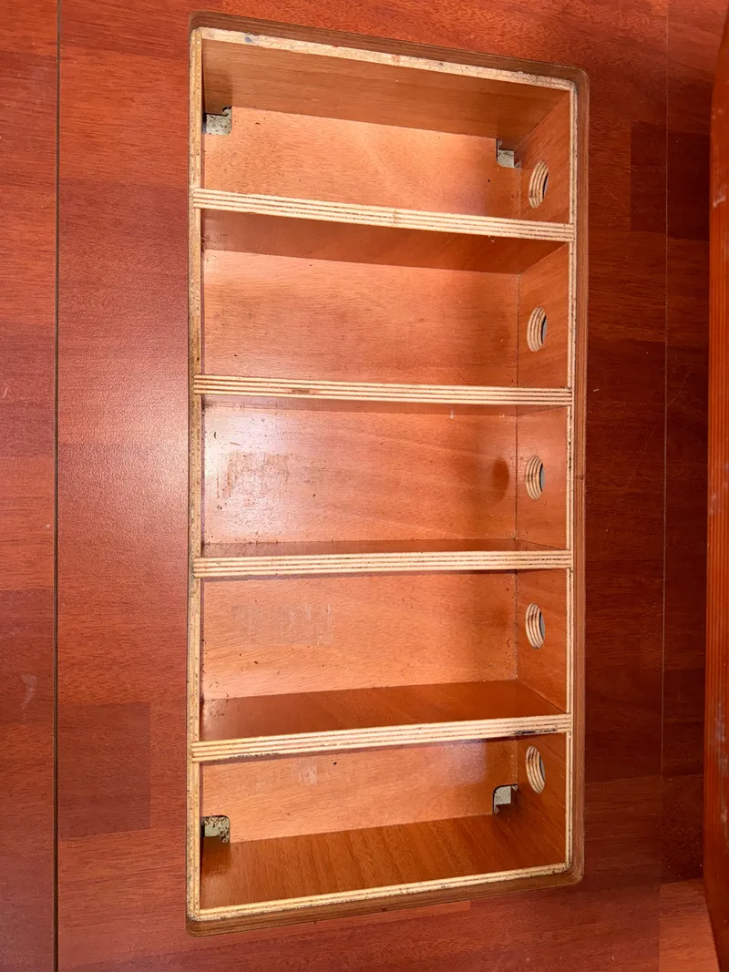 Slide: The Image of Wooden storage compartment on a 2016 Beneteau Oceanis 45 sailboat interior. - 6