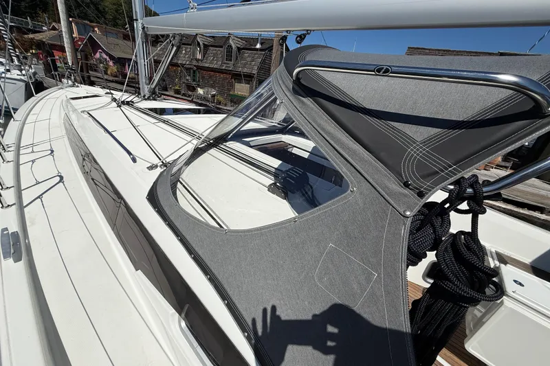 Slide: The Image of 2023 Jeanneau Sun Odyssey 410 sailboat deck with protective canopy and rigging. - 19