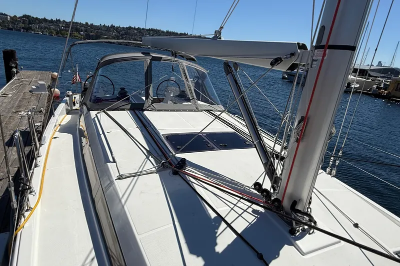 Slide: The Image of 2023 Jeanneau Sun Odyssey 410 sailboat docked, showcasing deck and rigging. - 21