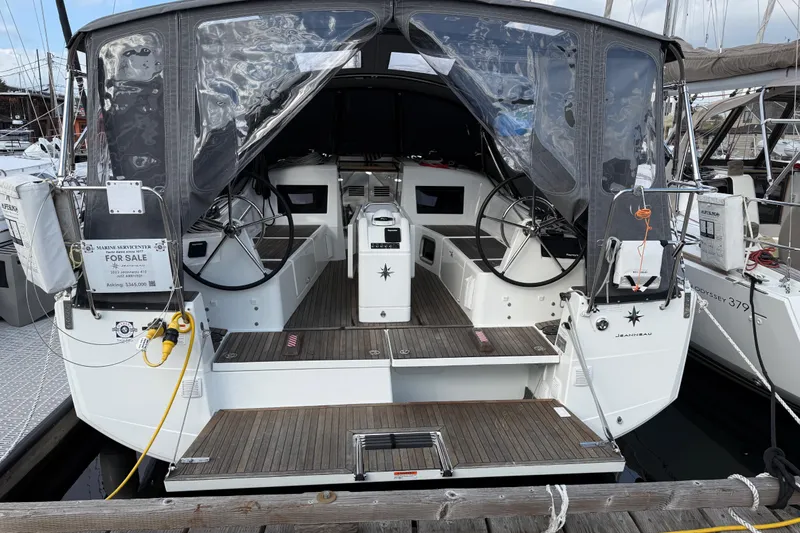 Slide: The Image of 2023 Jeanneau Sun Odyssey 410 sailboat for sale, docked with covered cockpit. - 28