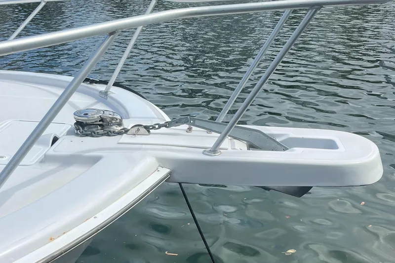 Slide: The Image of Bow of 2000 Luhrs Tournament 360 Convertible with anchor and railing over water. - 16