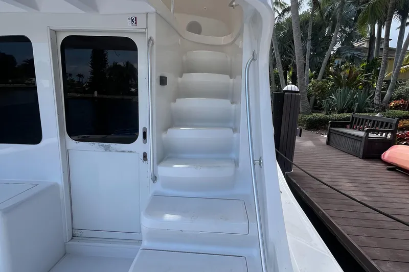 Slide: The Image of Staircase and door on 2000 Luhrs Tournament 360 Convertible yacht, dockside view. - 23