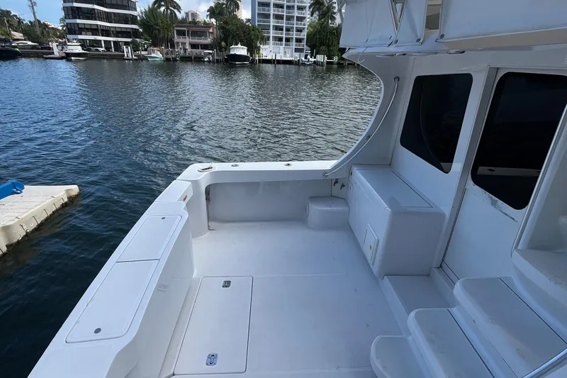 Slide: The Image of 2000 Luhrs Tournament 360 Convertible boat deck with waterfront view. - 26