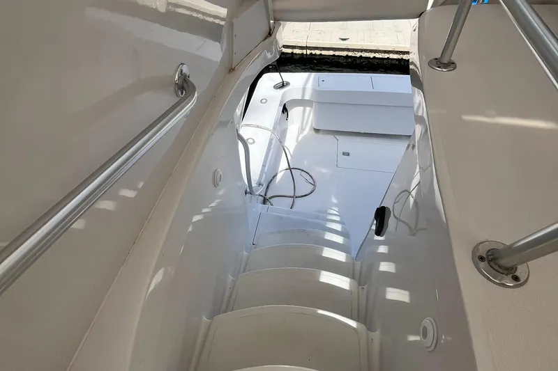 Slide: The Image of Stairway on 2000 Luhrs Tournament 360 Convertible boat, featuring sleek white design and handrails. - 27