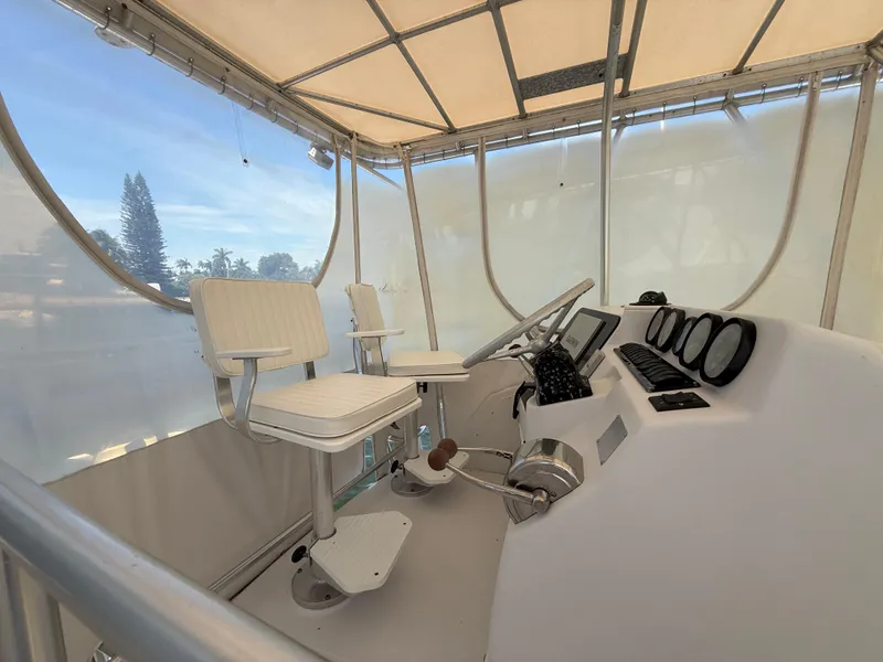 Slide: The Image of Helm of 2000 Luhrs Tournament 360 Convertible with dual seats and navigation instruments. - 30