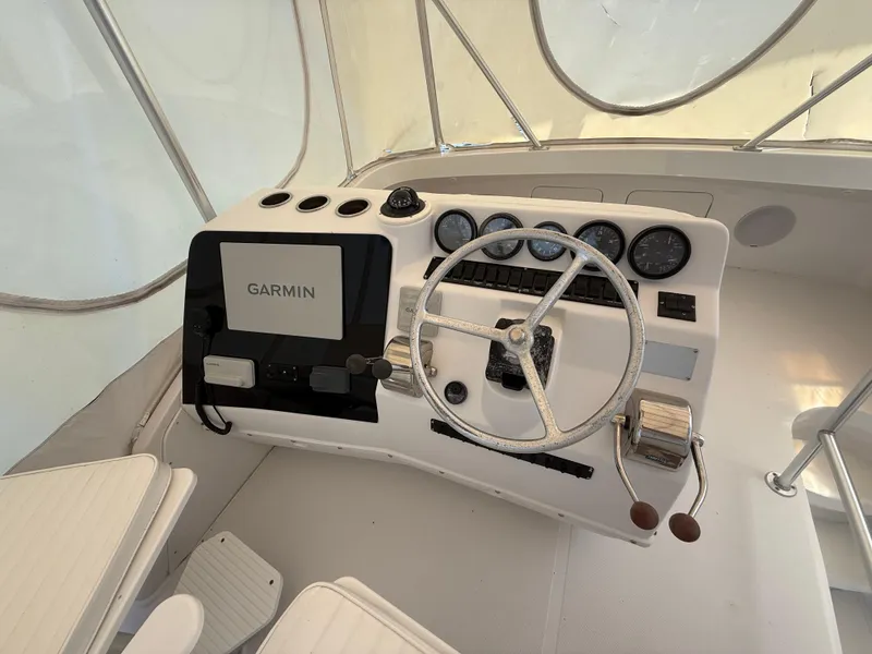 Slide: The Image of Cockpit of 2000 Luhrs Tournament 360 Convertible with Garmin navigation system. - 31