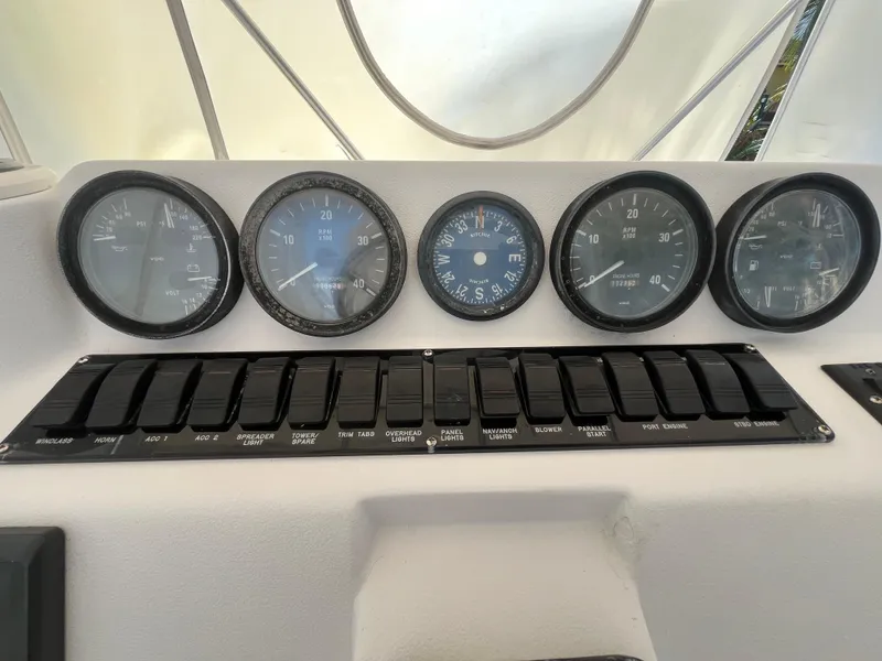 Slide: The Image of Control panel of a 2000 Luhrs Tournament 360 Convertible boat with gauges and switches. - 33