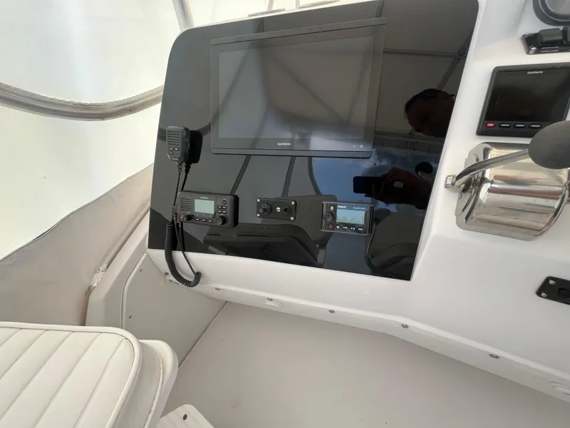 Slide: The Image of Control panel of a 2000 Luhrs Tournament 360 Convertible boat with navigation equipment. - 35