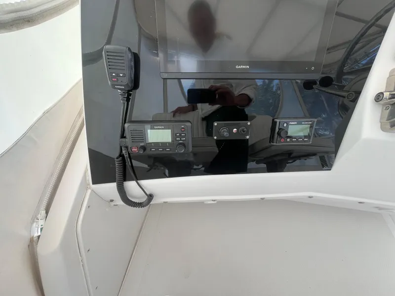 Slide: The Image of Control panel of a 2000 Luhrs Tournament 360 Convertible with Garmin electronics. - 36