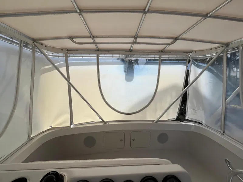 Slide: The Image of Interior view of 2000 Luhrs Tournament 360 Convertible boat with canopy and dashboard. - 37