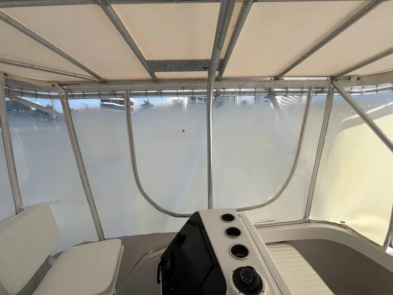 Slide: The Image of Interior view of 2000 Luhrs Tournament 360 Convertible boat with seating and control panel. - 38