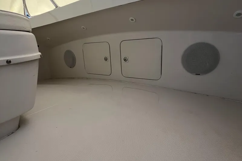 Slide: The Image of Interior of 2000 Luhrs Tournament 360 Convertible boat, featuring storage compartments and speaker. - 39