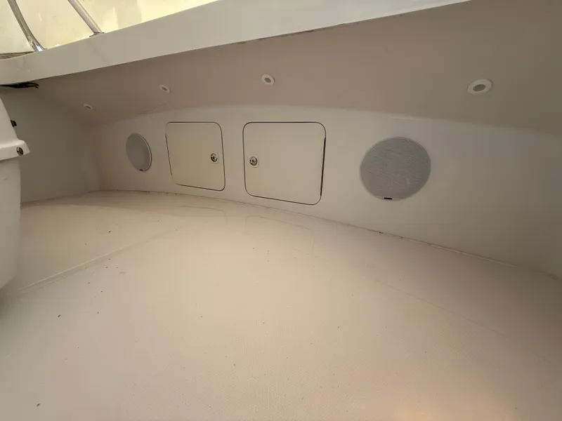 Slide: The Image of 2000 Luhrs Tournament 360 Convertible interior with storage compartments and speakers. - 40