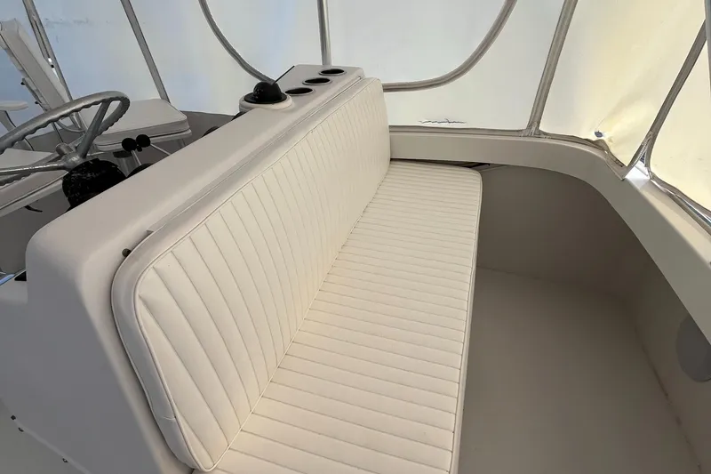 Slide: The Image of 2000 Luhrs Tournament 360 Convertible boat interior with white cushioned seating. - 41
